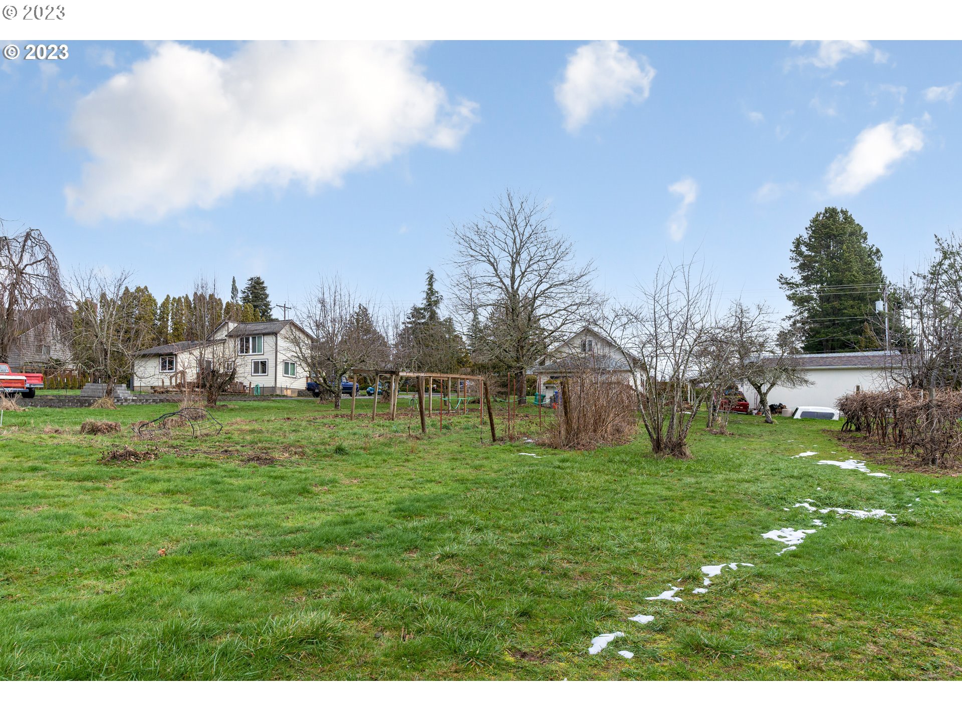 425 Southeast Williams Road Gresham, OR 97080 - Photo 17 of 30 a grassy field with trees in the background