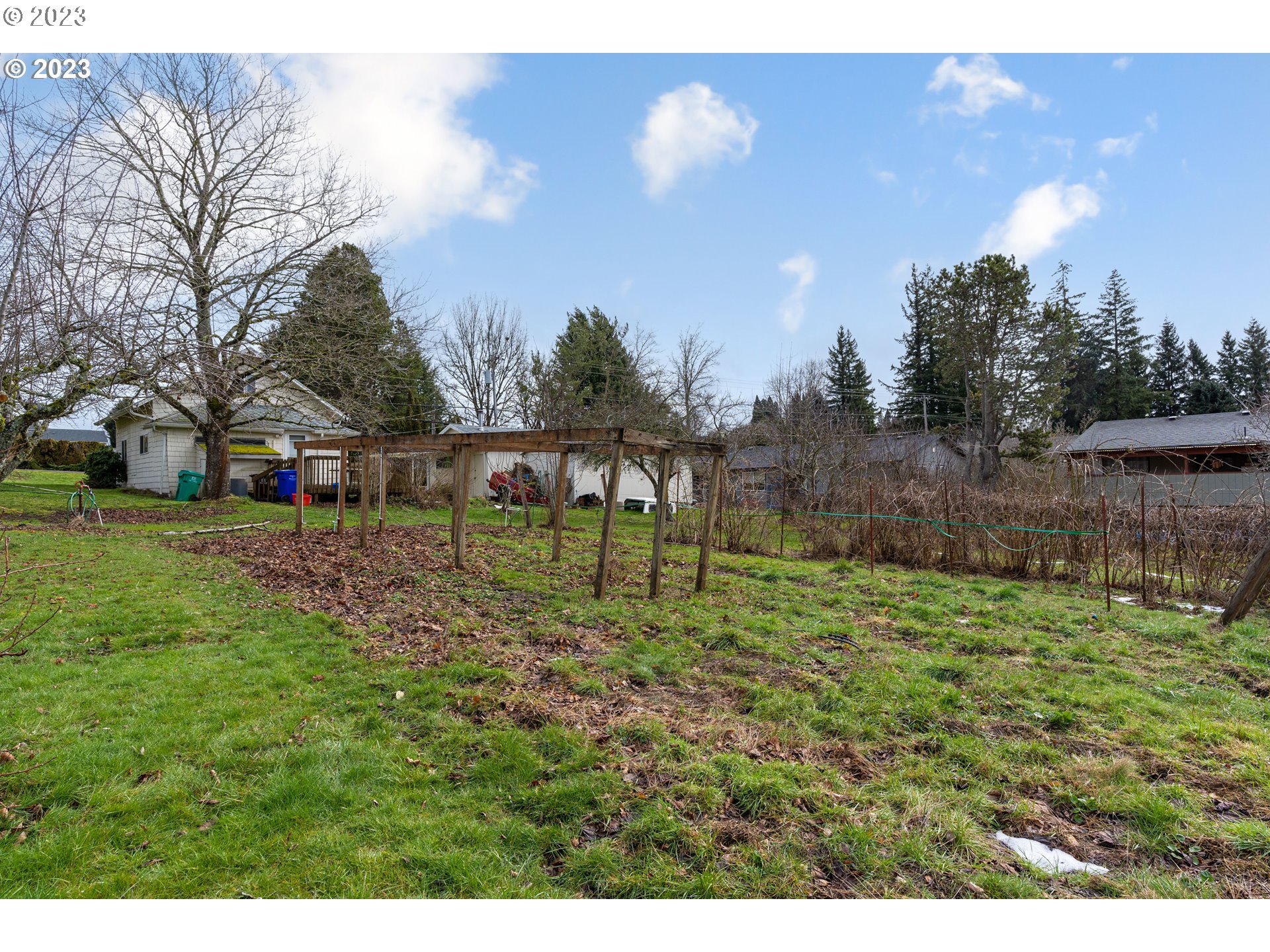 425 Southeast Williams Road Gresham, OR 97080 - Photo 9 of 30 a view of a house with a yard and sitting area