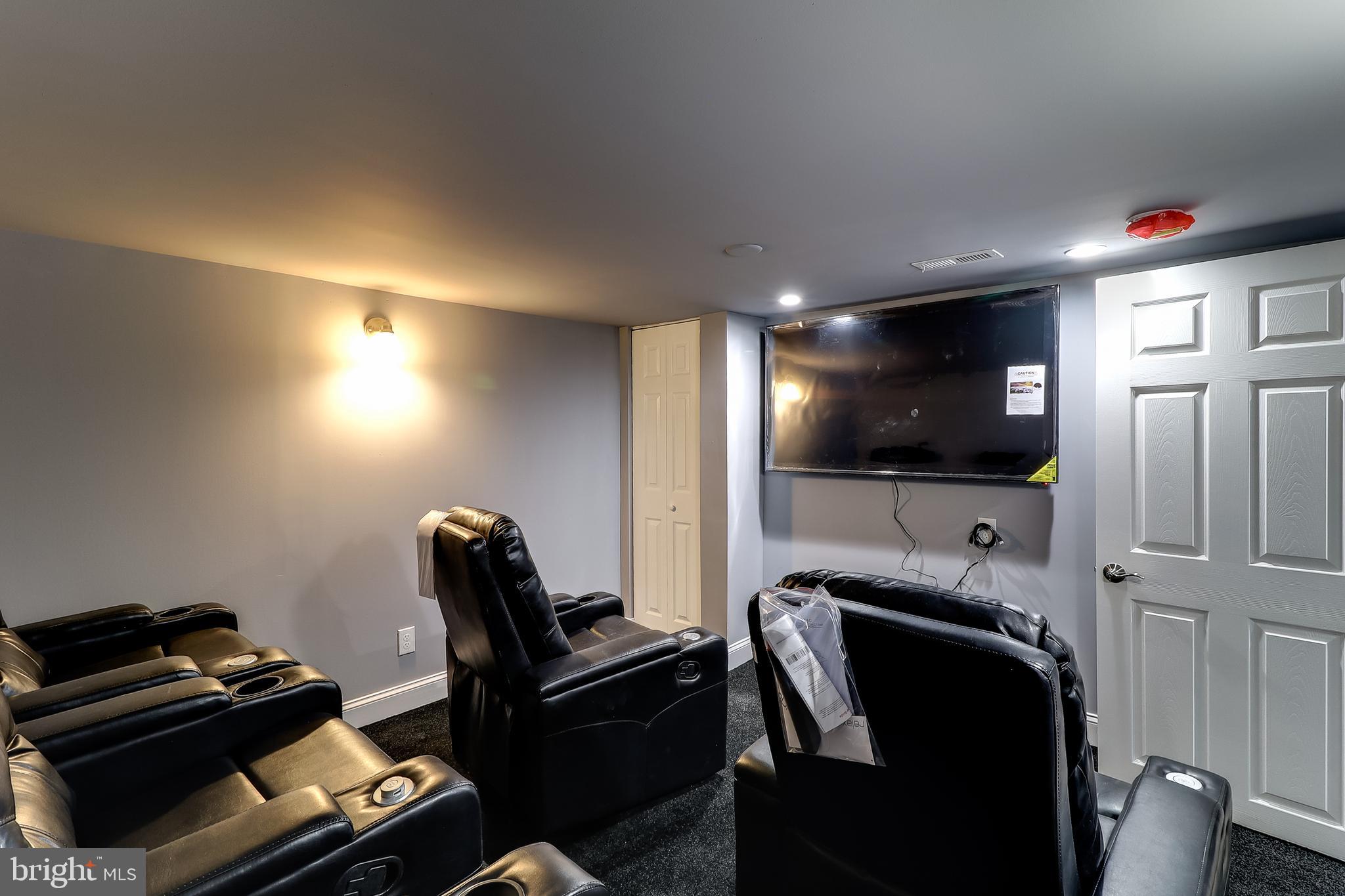 2004 Oakland Road Baltimore, MD 21220 - Photo 5 of 48 Theater Room - Lower Level w/ 5 Chairs & 65" TV