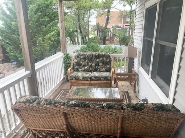 a view of balcony with furniture