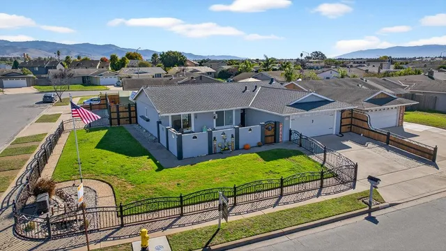 an aerial view of a house having swimming pool garden and patio