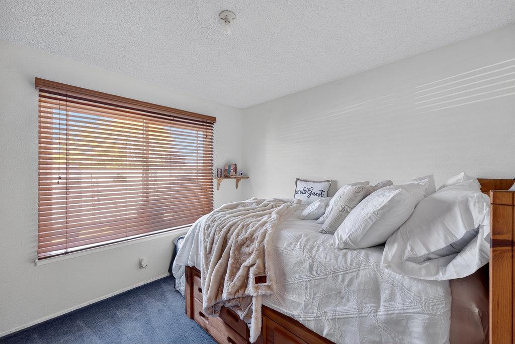 12932 Truman Street Salinas, CA 93906 - Photo 14 of 24 a view of a bedroom with a bed and a window
