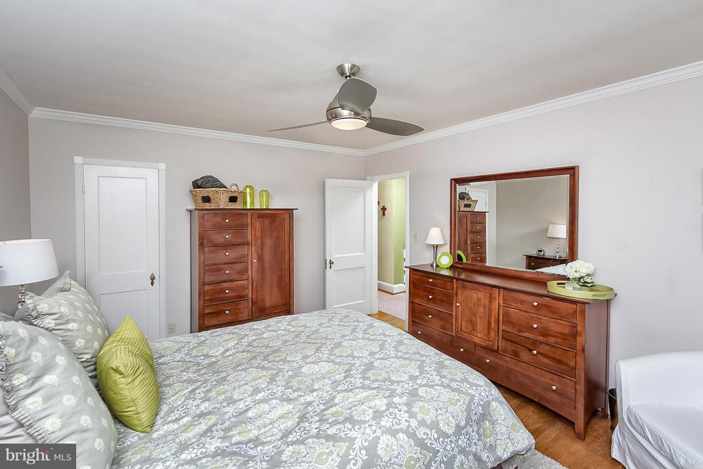 227 Dumbarton Road Baltimore, MD 21212 - Photo 15 of 30 a bedroom with a bed and a dresser