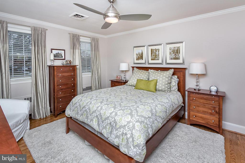 227 Dumbarton Road Baltimore, MD 21212 - Photo 16 of 30 a bedroom with a bed and wooden floor