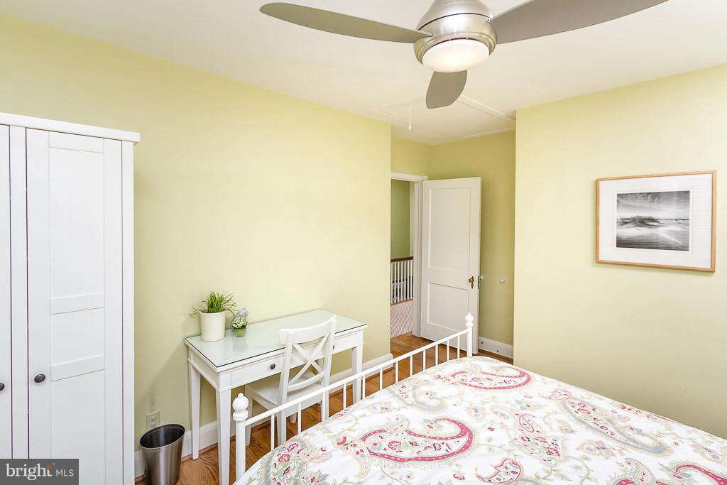 227 Dumbarton Road Baltimore, MD 21212 - Photo 18 of 30 a bedroom with a bed and a chandelier