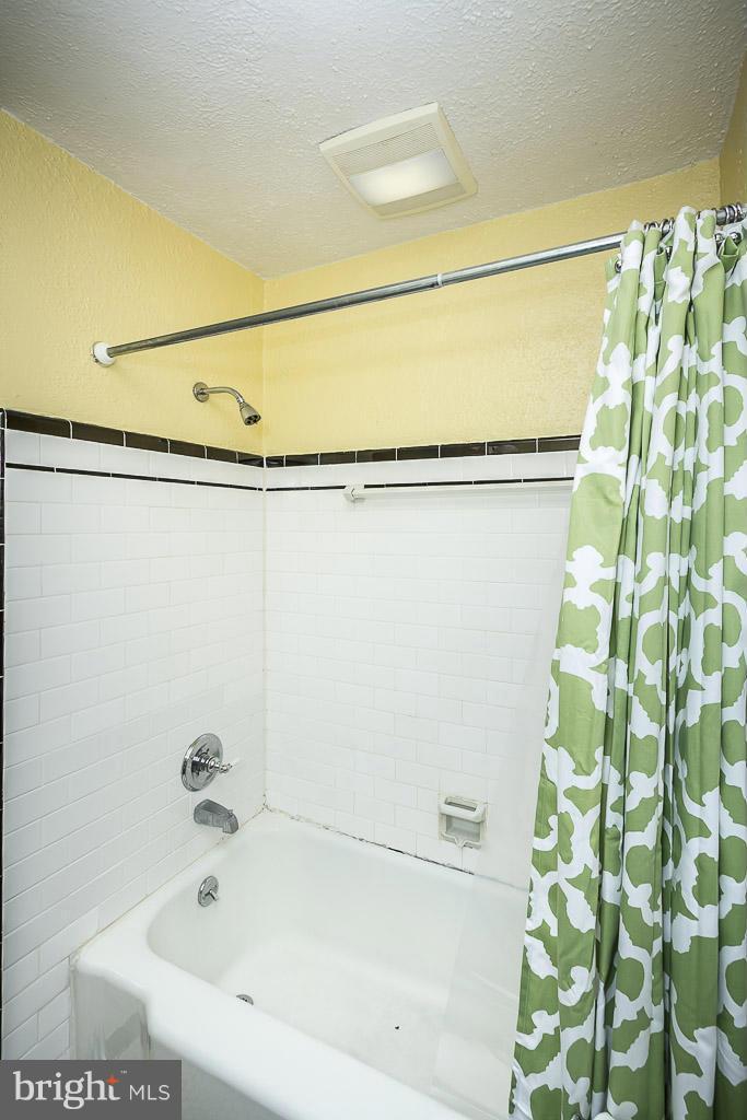 227 Dumbarton Road Baltimore, MD 21212 - Photo 23 of 30 a bathroom with a bathtub and shower