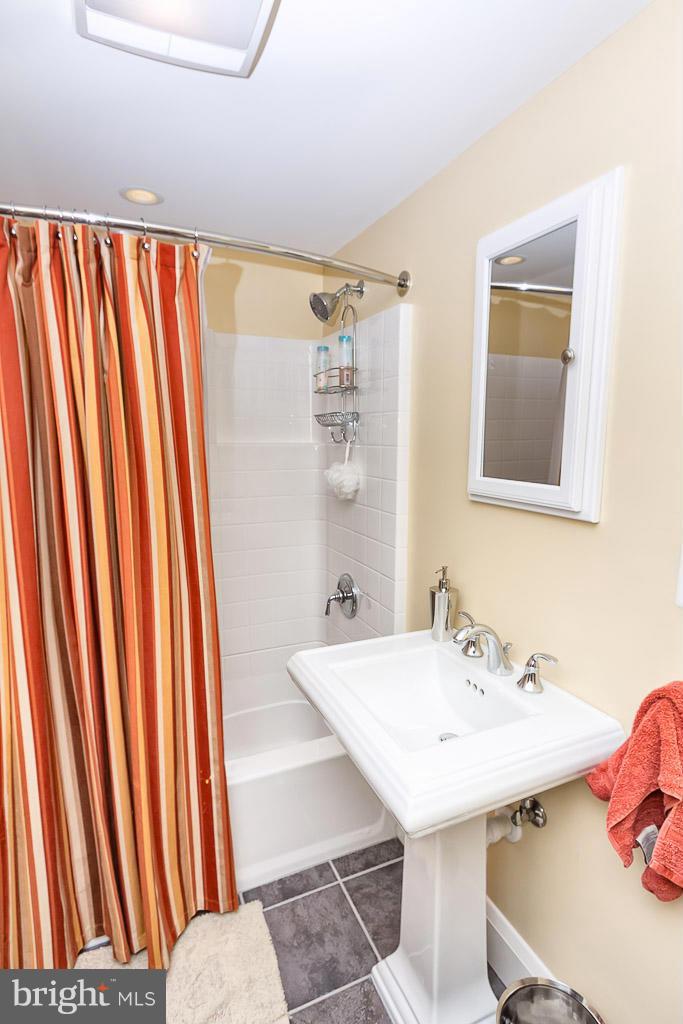 227 Dumbarton Road Baltimore, MD 21212 - Photo 25 of 30 a bathroom with a sink a mirror and a toilet