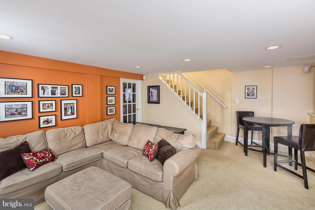 227 Dumbarton Road Baltimore, MD 21212 - Photo 26 of 30 a living room with furniture and a dining table with wooden floor