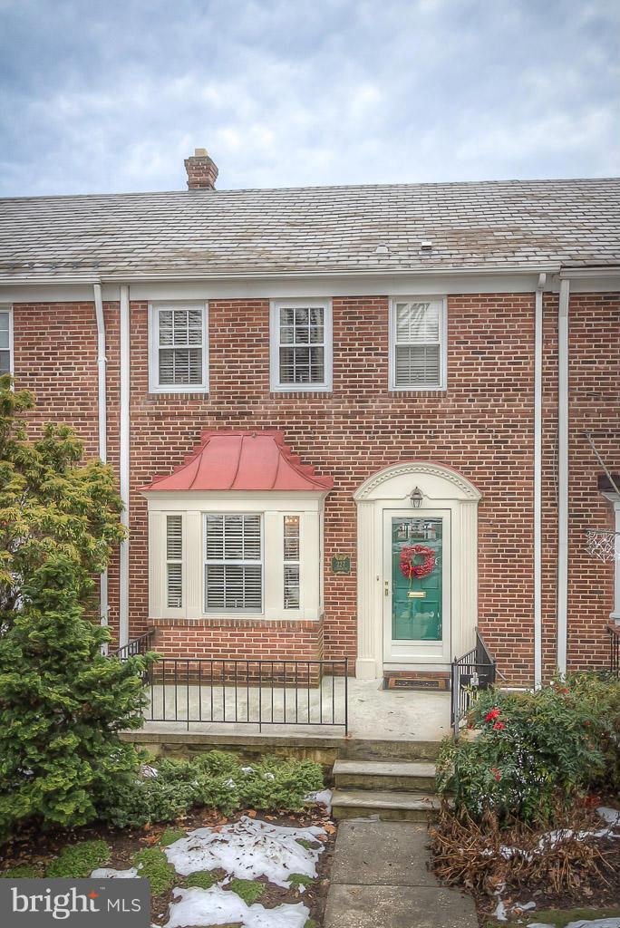 227 Dumbarton Road Baltimore, MD 21212 - Photo 5 of 30 front view of a brick house with a yard