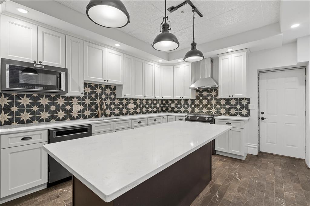 2217 Sarah Street Pittsburgh, PA 15203 - Photo 11 of 33 a kitchen with a sink a stove and oven
