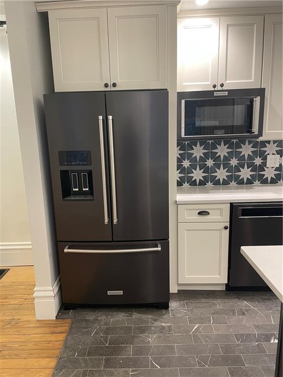 2217 Sarah Street Pittsburgh, PA 15203 - Photo 2 of 33 a kitchen with metallic refrigerator and microwave