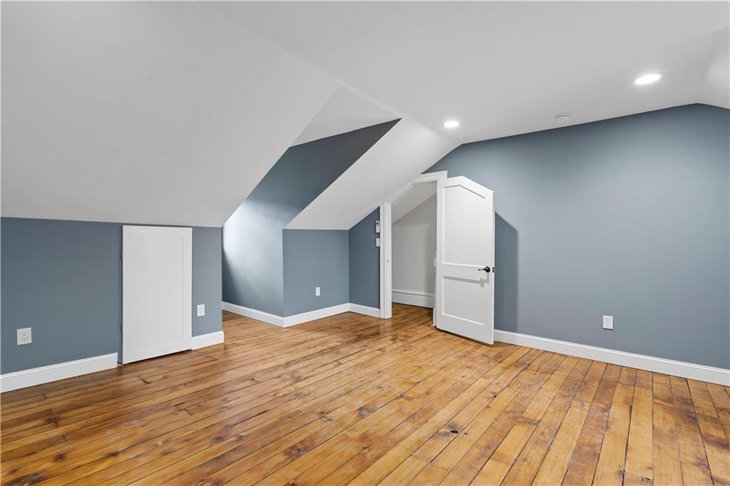 2217 Sarah Street Pittsburgh, PA 15203 - Photo 28 of 33 a view of an empty room with wooden floor