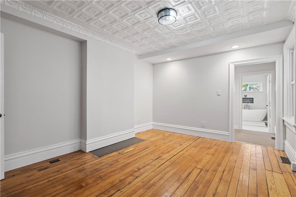2217 Sarah Street Pittsburgh, PA 15203 - Photo 6 of 33 wooden floor in an empty room