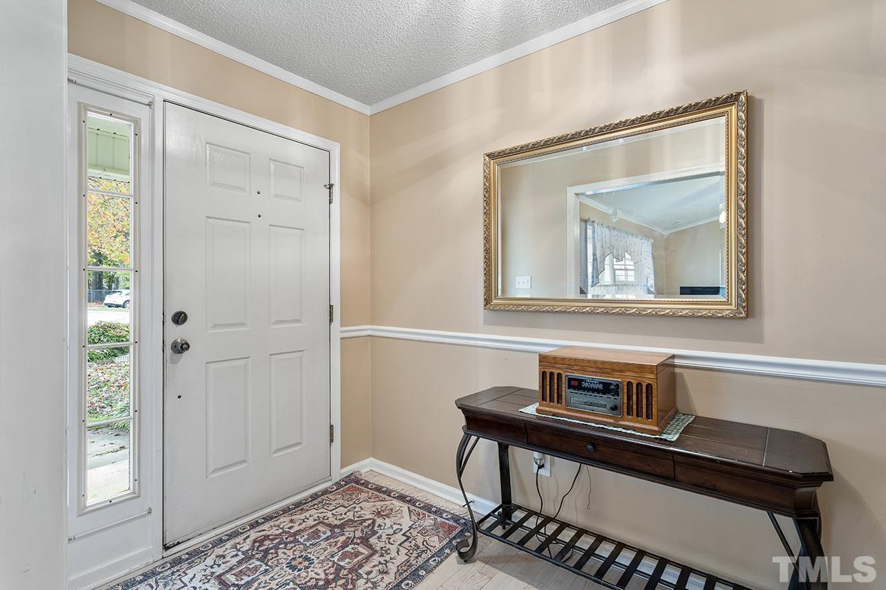 1406 Buckhorn Road Garner, NC 27529 - Photo 12 of 29 a living room with a bed and a window