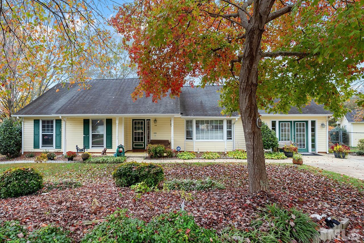 1406 Buckhorn Road Garner, NC 27529 - Photo 2 of 29 a front view of a house with garden
