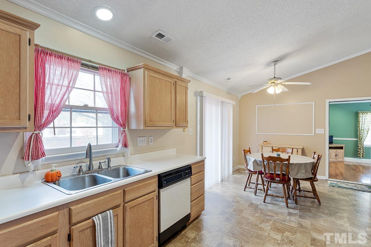 1406 Buckhorn Road Garner, NC 27529 - Photo 21 of 29 a kitchen with a sink cabinets and window