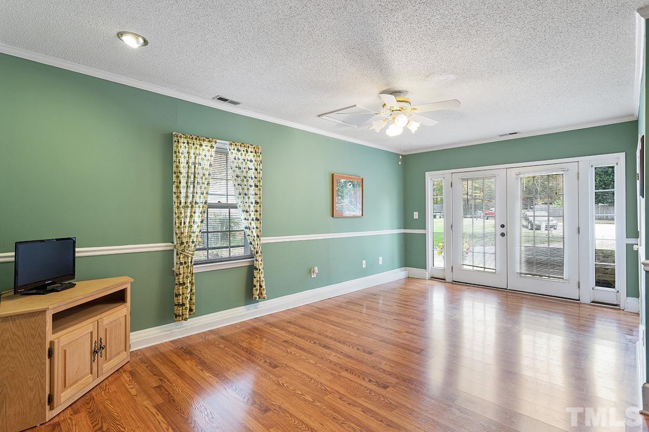 1406 Buckhorn Road Garner, NC 27529 - Photo 22 of 29 a open kitchen with window and wooden floor
