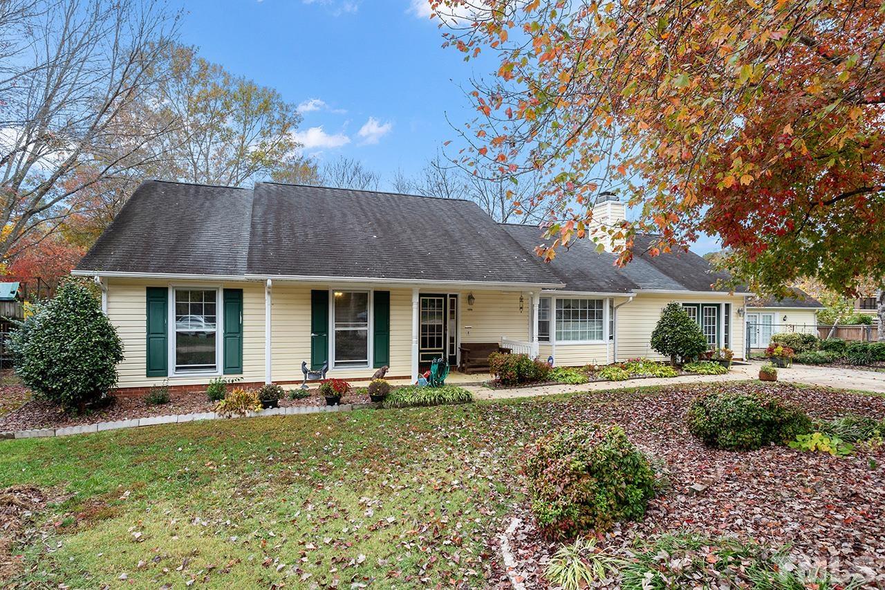 1406 Buckhorn Road Garner, NC 27529 - Photo 3 of 29 a front view of a house with garden