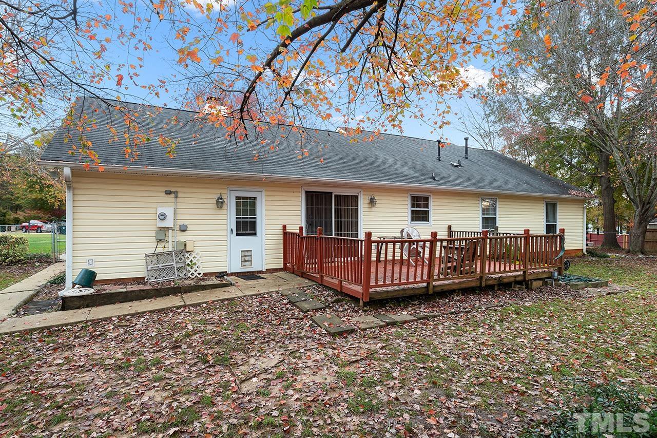 1406 Buckhorn Road Garner, NC 27529 - Photo 5 of 29 a view of a house with a yard and deck
