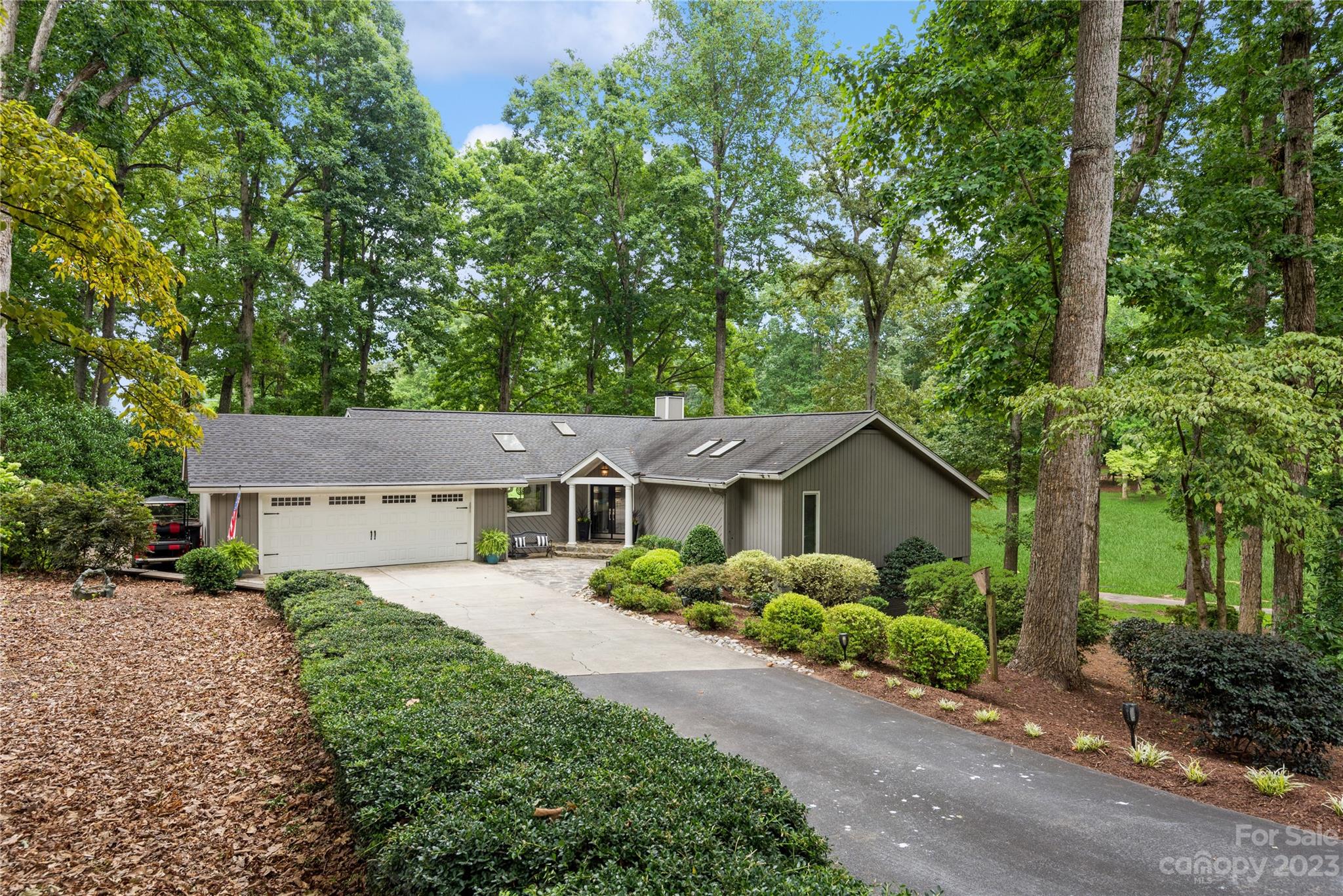 92 Fairway Ridge, Unit 8 Clover, SC 29710 - Photo 2 of 34 a front view of a house with a garden