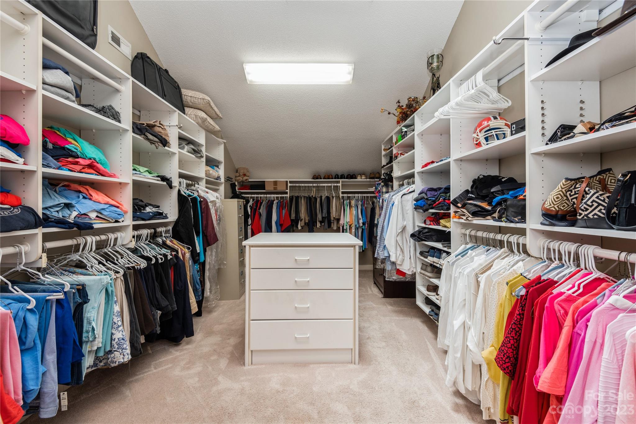 92 Fairway Ridge, Unit 8 Clover, SC 29710 - Photo 23 of 34 a view of walk in closet with clothes and shoes