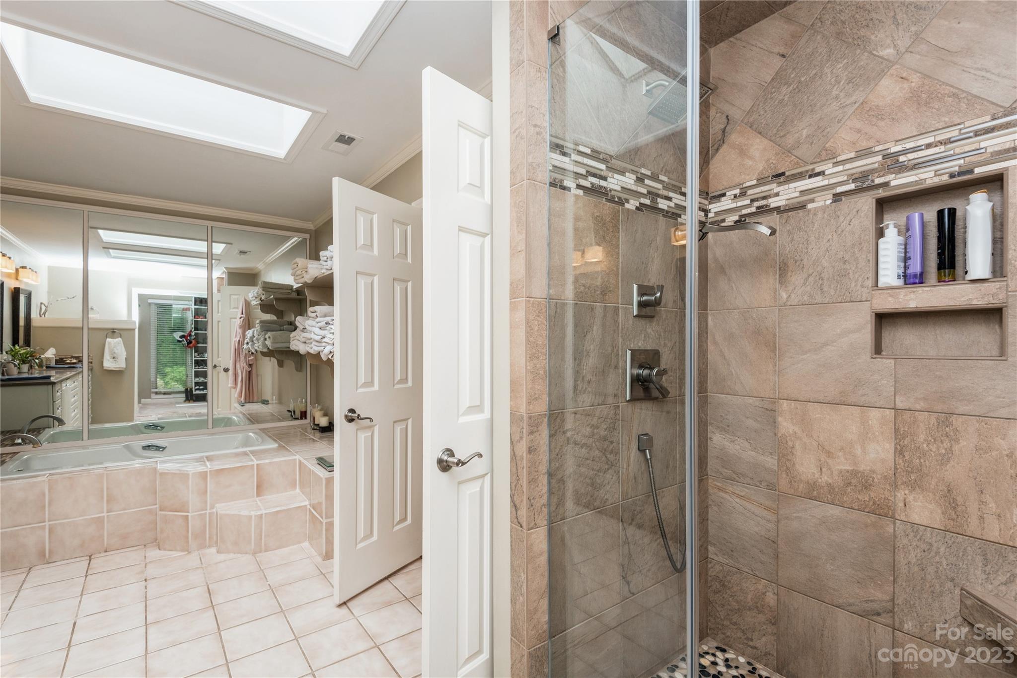 92 Fairway Ridge, Unit 8 Clover, SC 29710 - Photo 24 of 34 a bathroom with a glass shower door and a shower