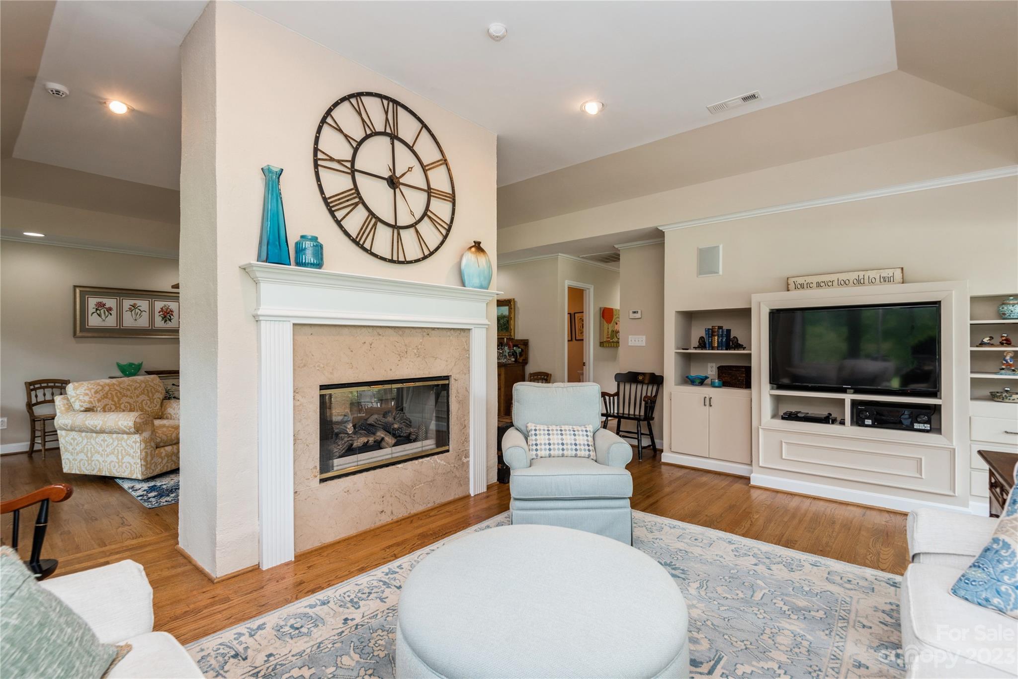 92 Fairway Ridge, Unit 8 Clover, SC 29710 - Photo 8 of 34 a living room with furniture a flat screen tv and a fireplace