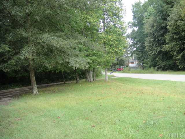 Napoleon Road Selma, NC 27576 - Photo 3 of 4 Main road with entry onto gravel drive that can actually circle around. Land