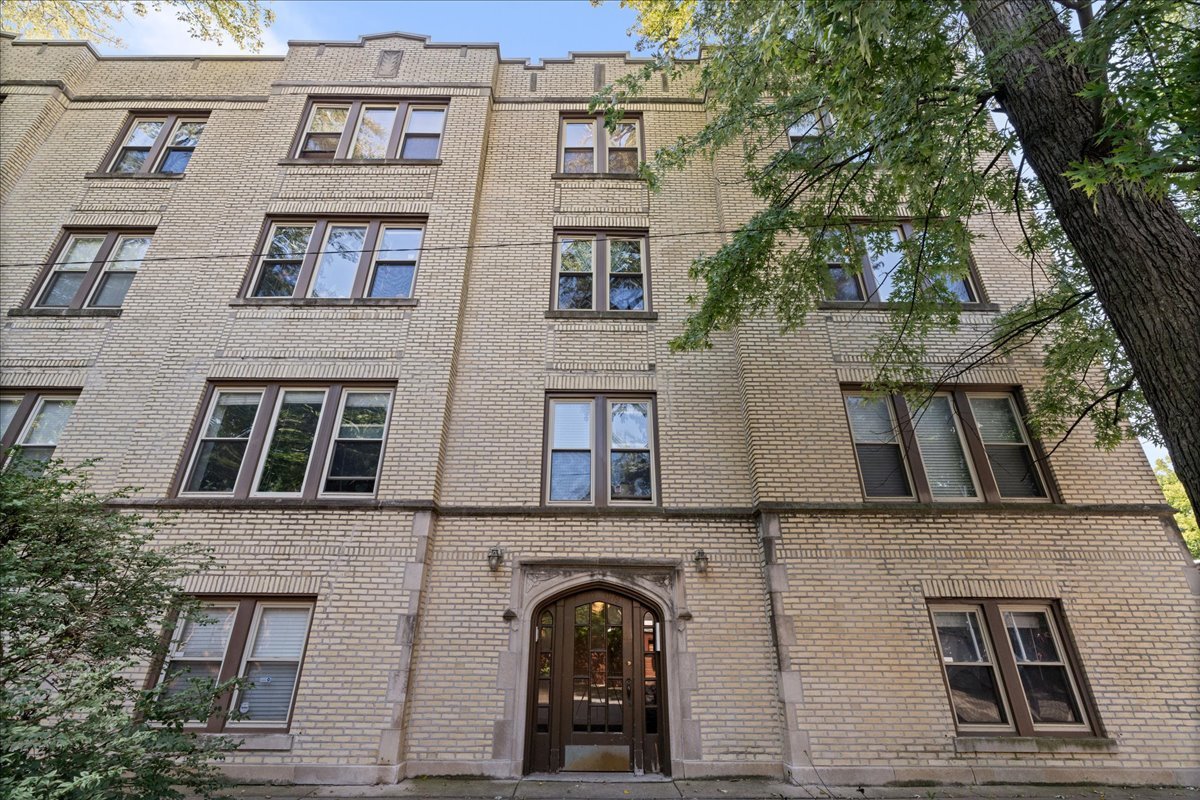 3107 West George Street, Unit 2 Chicago, IL 60618 - Photo 1 of 17 a front view of a building with large windows