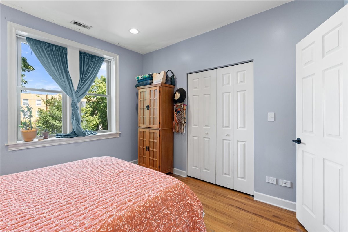 3107 West George Street, Unit 2 Chicago, IL 60618 - Photo 11 of 17 a bedroom with a bed and a window