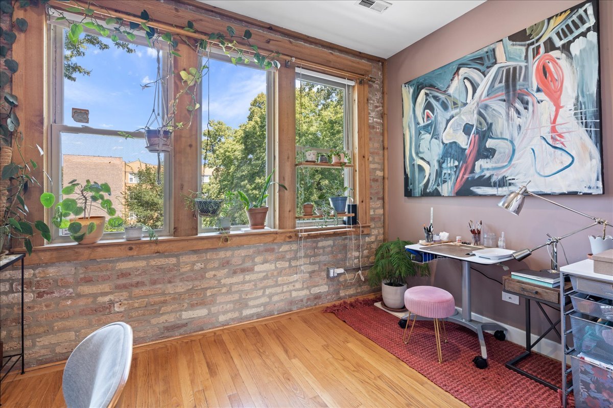 3107 West George Street, Unit 2 Chicago, IL 60618 - Photo 12 of 17 a living room with furniture and a large window