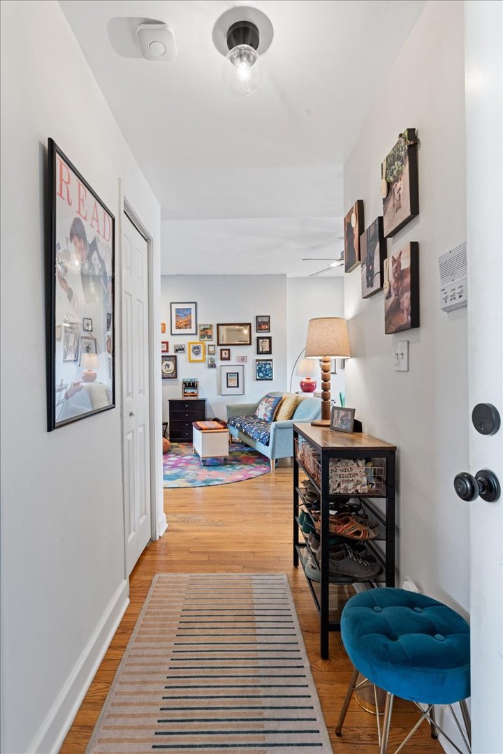 3107 West George Street, Unit 2 Chicago, IL 60618 - Photo 17 of 17 a living room with furniture and a flat screen tv