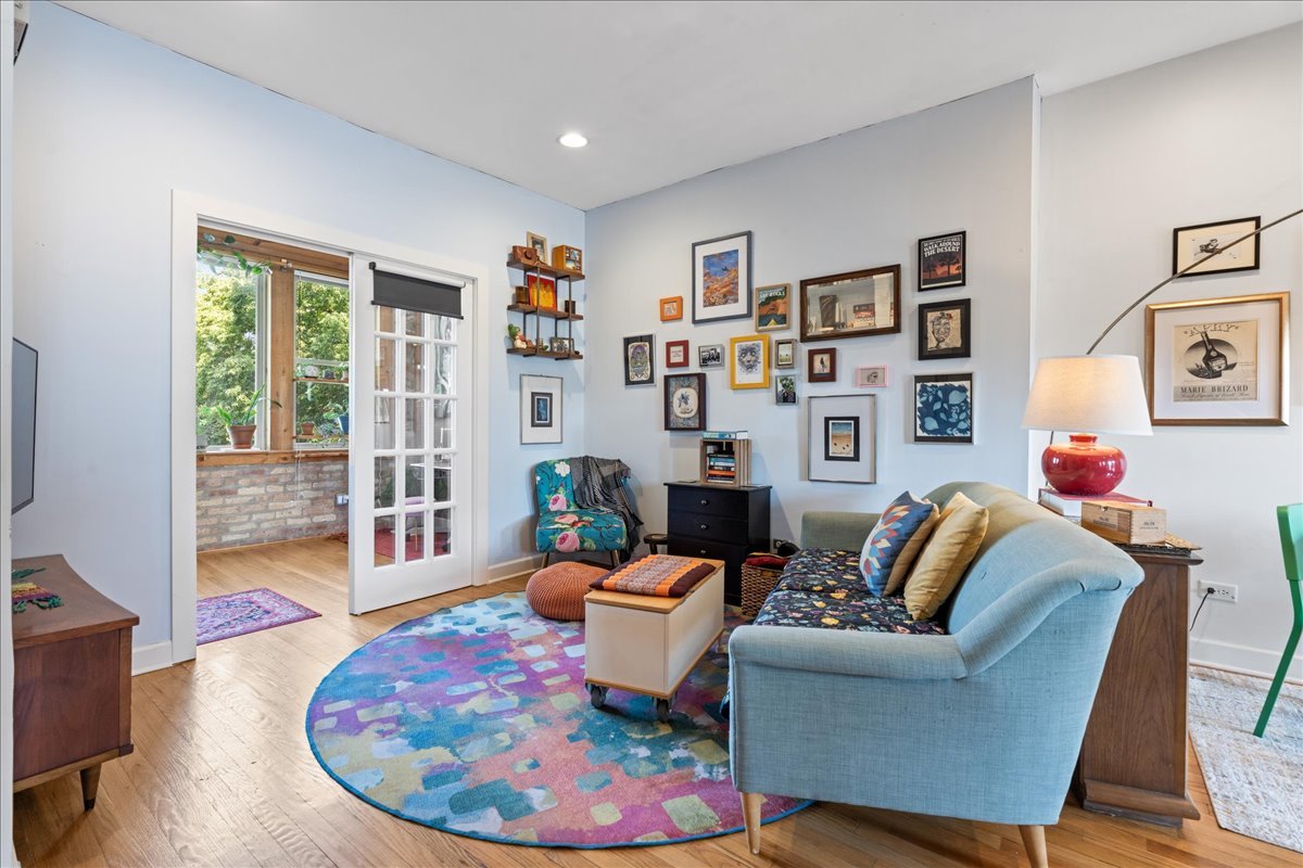 3107 West George Street, Unit 2 Chicago, IL 60618 - Photo 3 of 17 a living room with furniture a rug and a flat screen tv