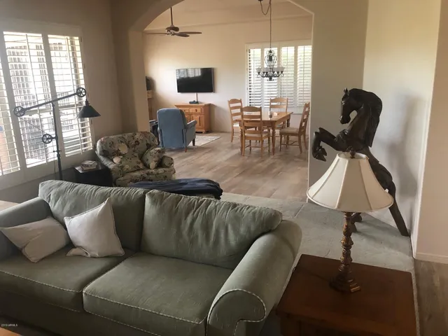 a living room with furniture and a window