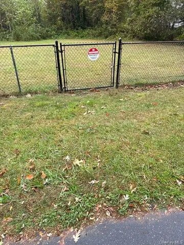 a view of parking with sign board