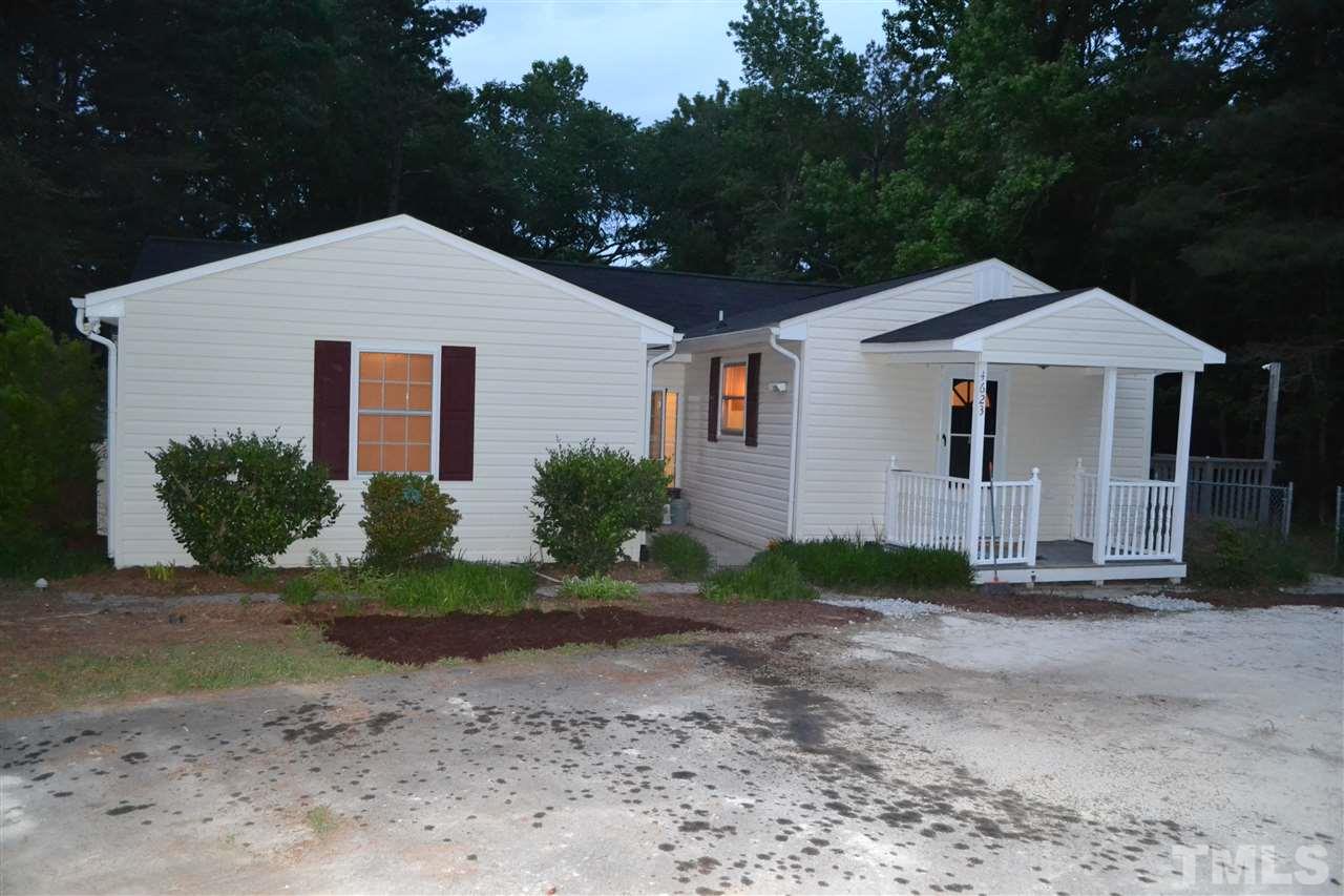 4623 Bragg Road Durham, NC 27704 - Photo 2 of 25 a front view of a house with garden