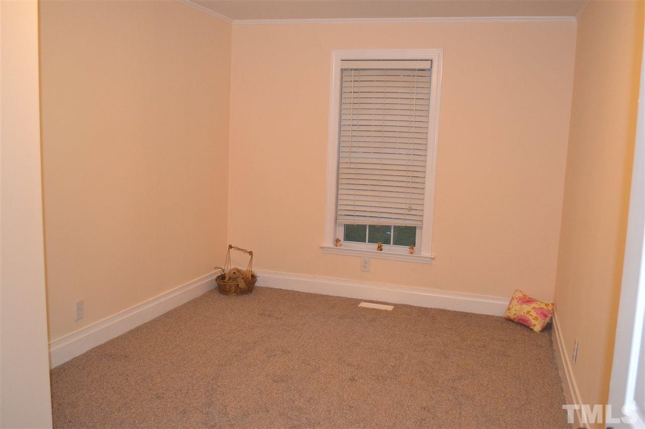 4623 Bragg Road Durham, NC 27704 - Photo 15 of 25 a view of an empty room with a window