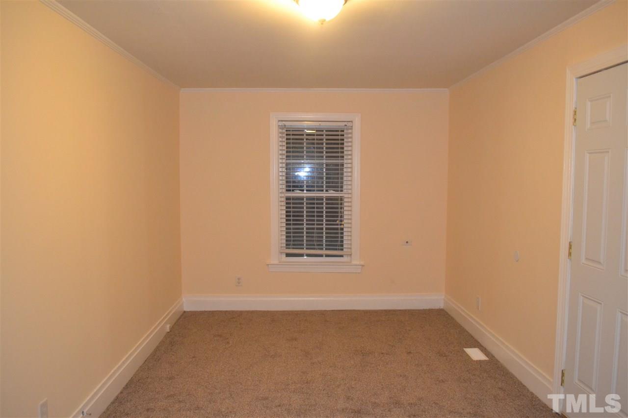 4623 Bragg Road Durham, NC 27704 - Photo 17 of 25 a view of an empty room with a window