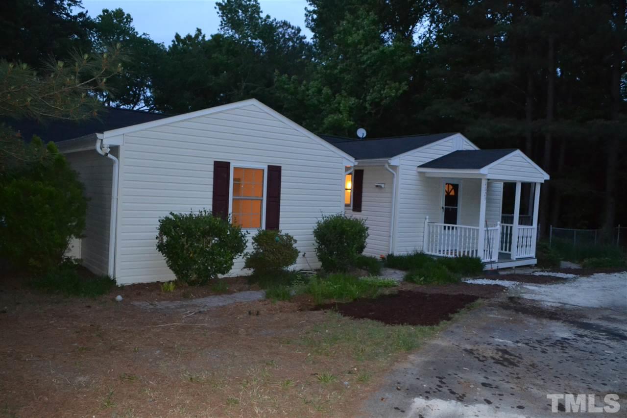 4623 Bragg Road Durham, NC 27704 - Photo 22 of 25 a front view of a house with garden