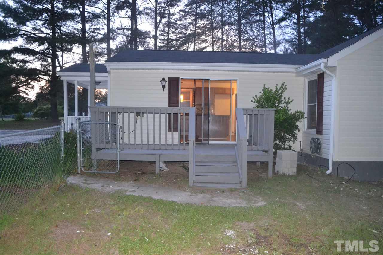 4623 Bragg Road Durham, NC 27704 - Photo 25 of 25 a view of backyard with deck and outdoor seating