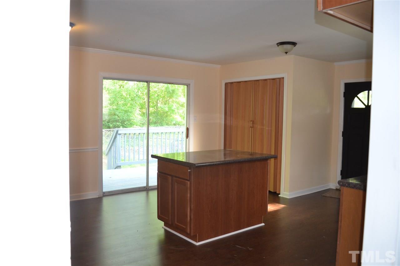4623 Bragg Road Durham, NC 27704 - Photo 5 of 25 a room with window and cabinet