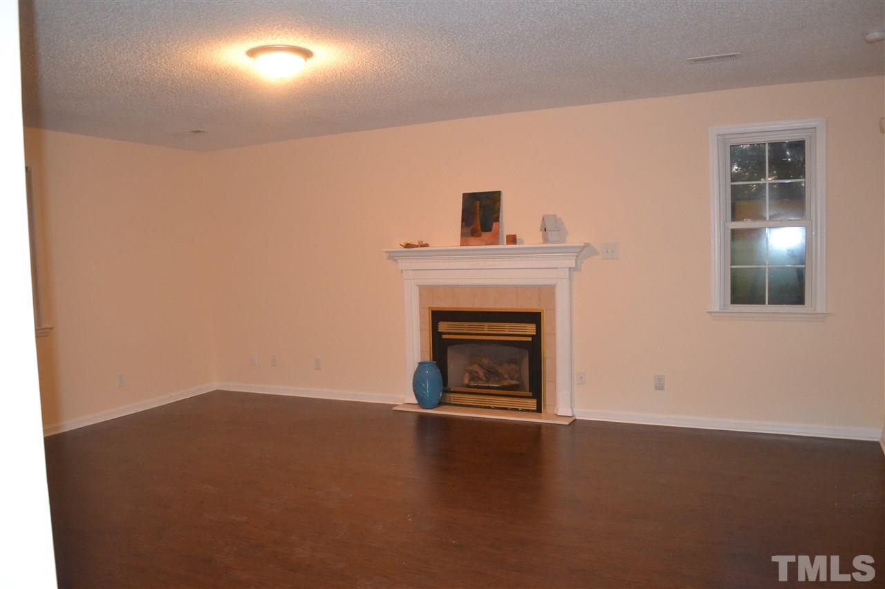 4623 Bragg Road Durham, NC 27704 - Photo 6 of 25 a view of empty room with a fireplace