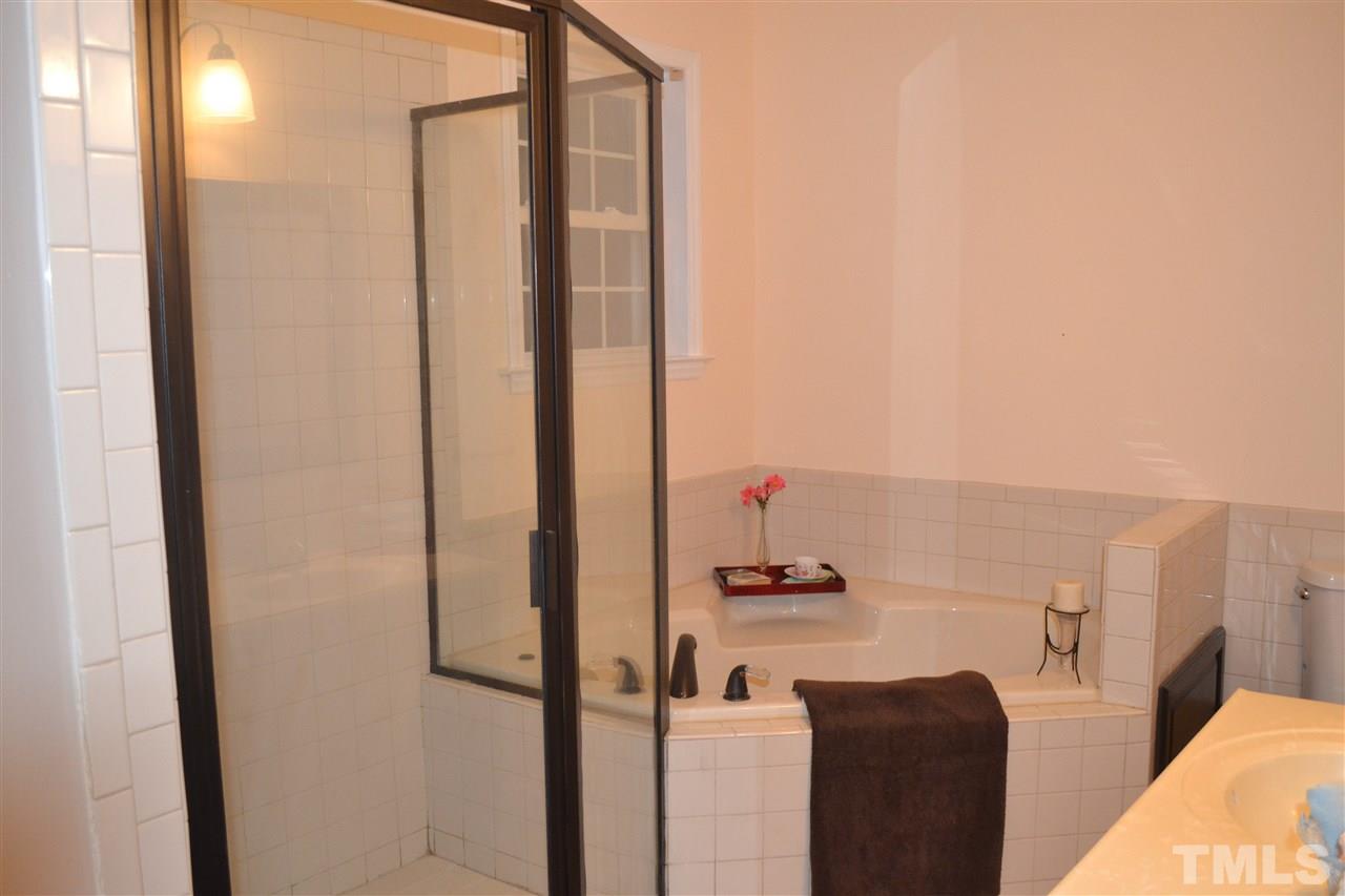 4623 Bragg Road Durham, NC 27704 - Photo 9 of 25 a bathroom with a shower