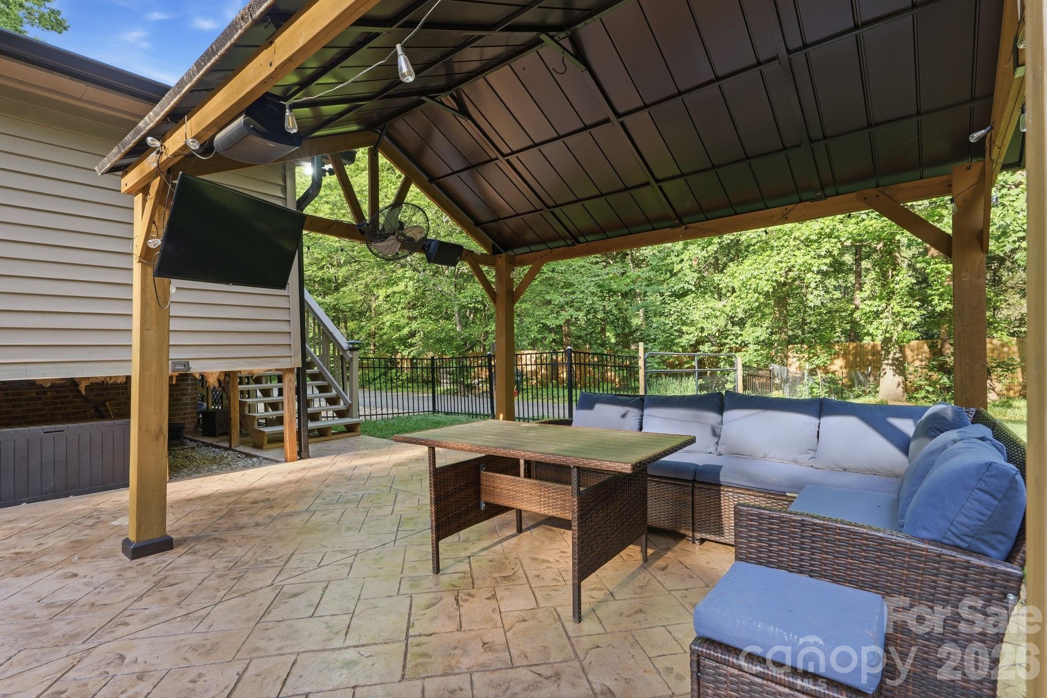5347 Haney Road York, SC 29745 - Photo 36 of 39 a outdoor space with patio the couches and a dining table with garden view