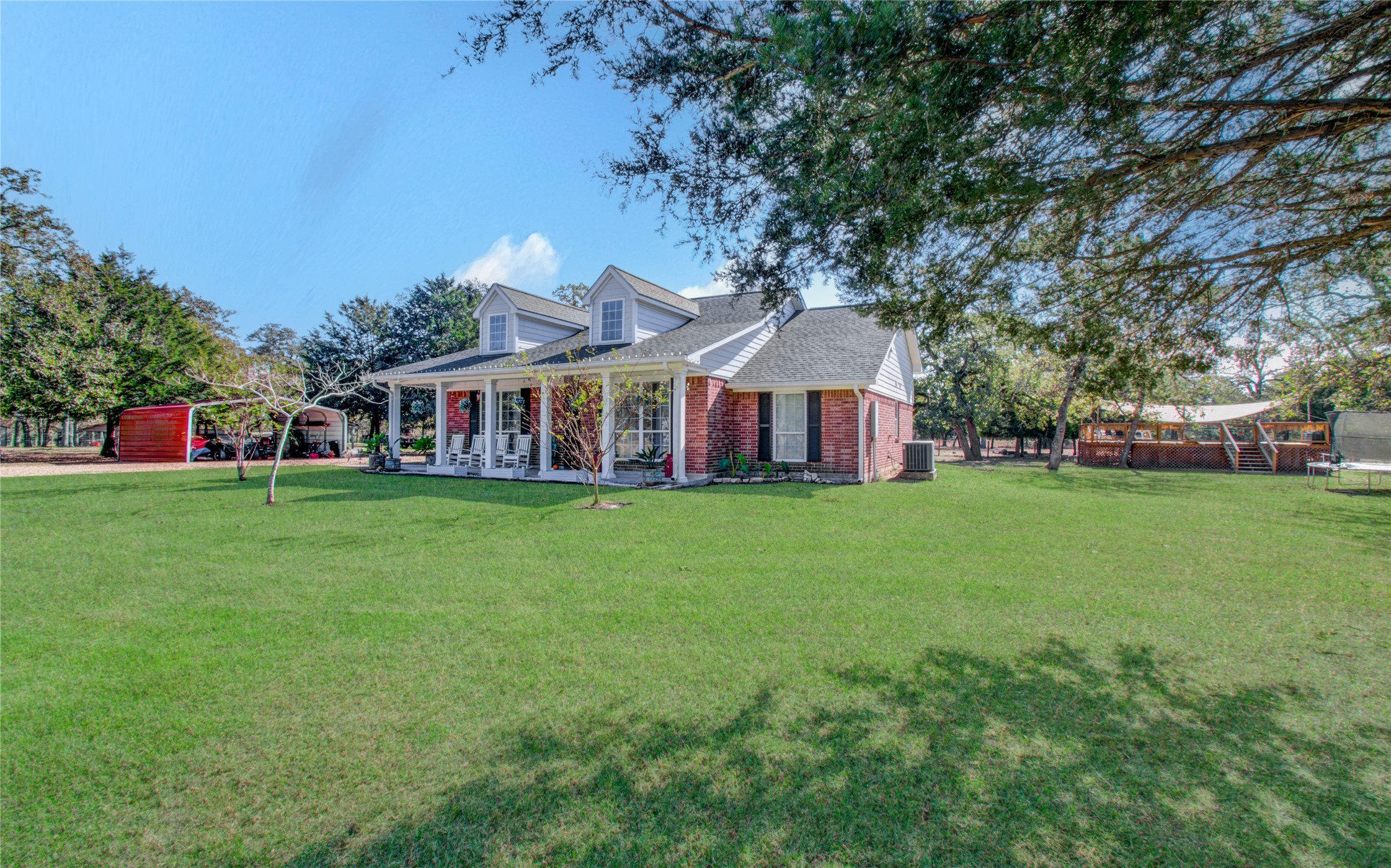 1779 County Road 151 Columbus, TX 78934 - Photo 1 of 47 a front view of house with yard and green space