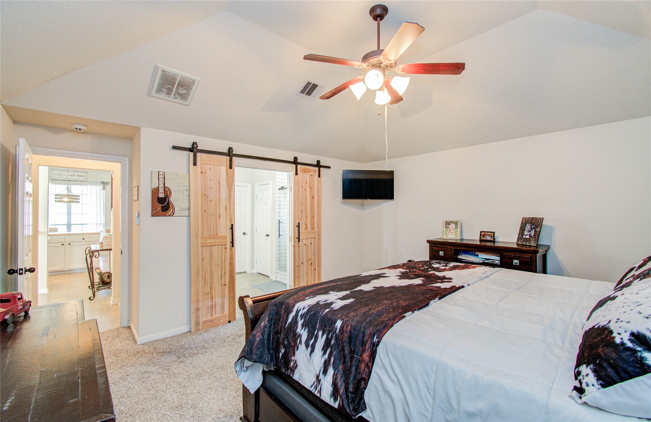 1779 County Road 151 Columbus, TX 78934 - Photo 15 of 47 a bedroom with a bed and a chandelier