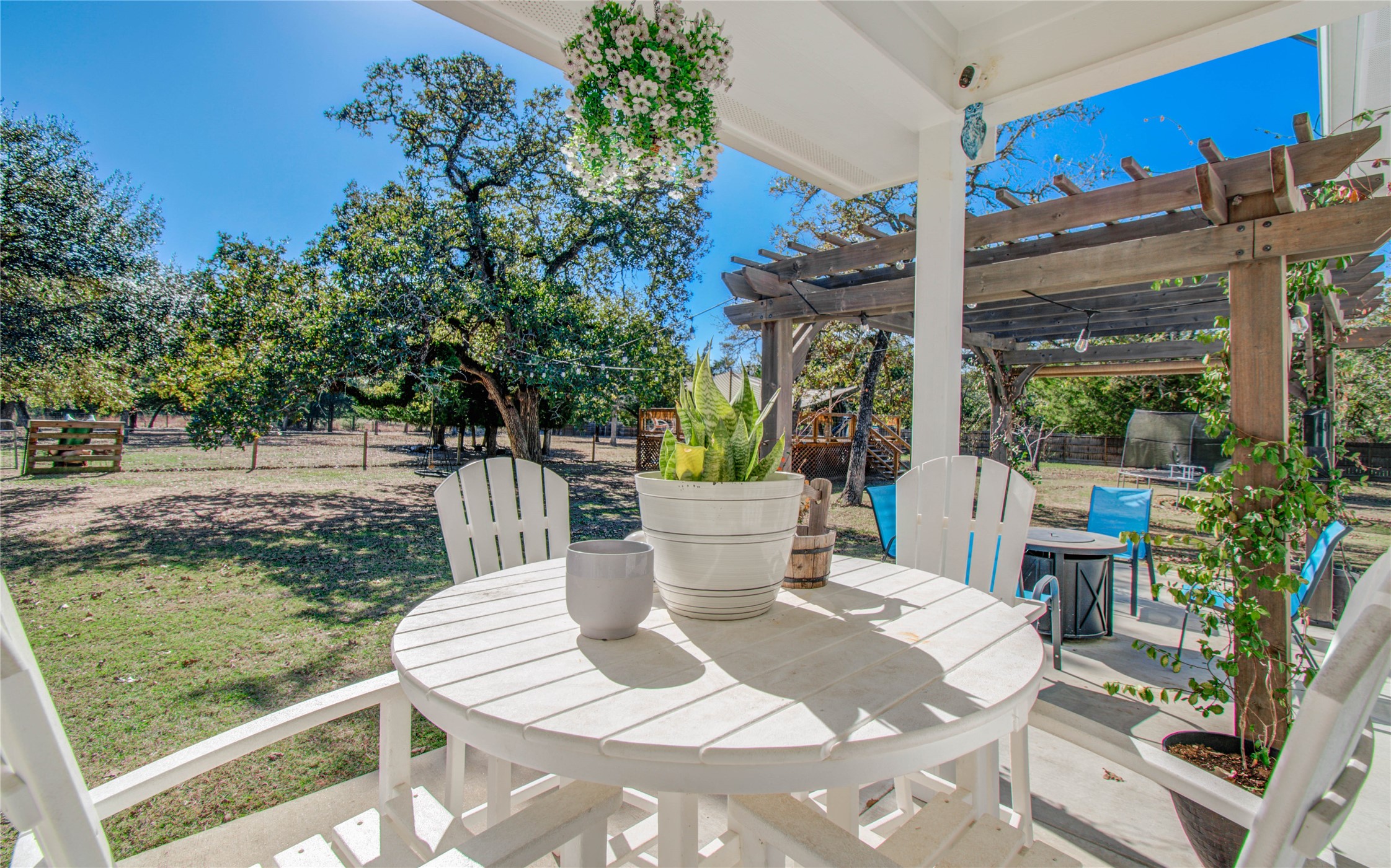 1779 County Road 151 Columbus, TX 78934 - Photo 25 of 47 a view of a patio with table and chairs and potted plants