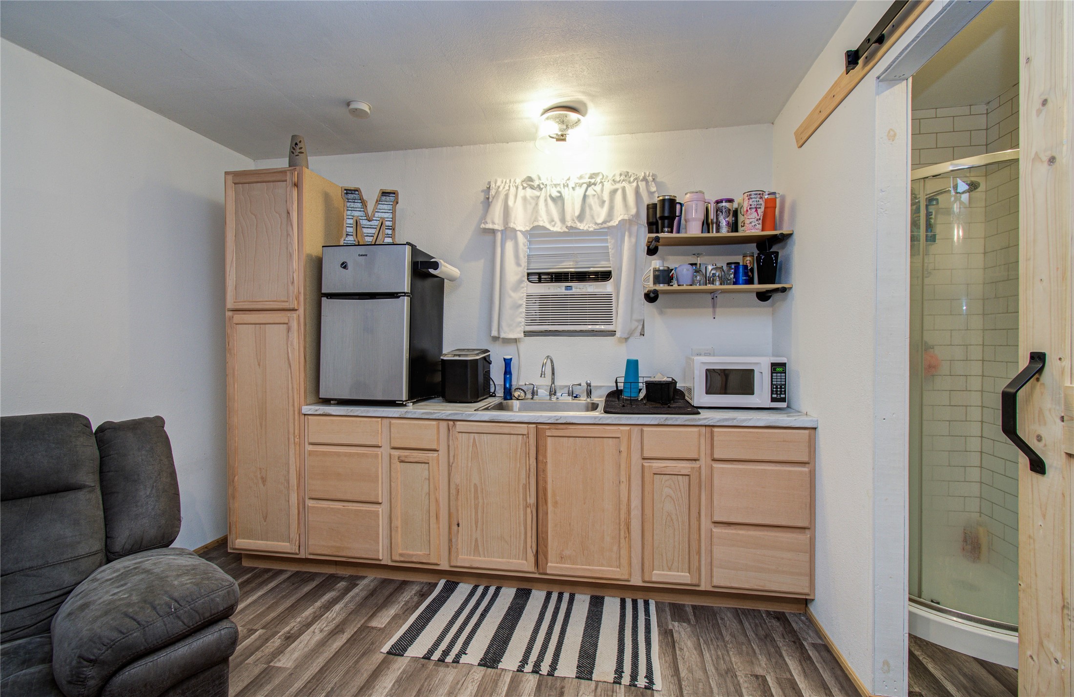 1779 County Road 151 Columbus, TX 78934 - Photo 33 of 47 a kitchen with stainless steel appliances a refrigerator and cabinets