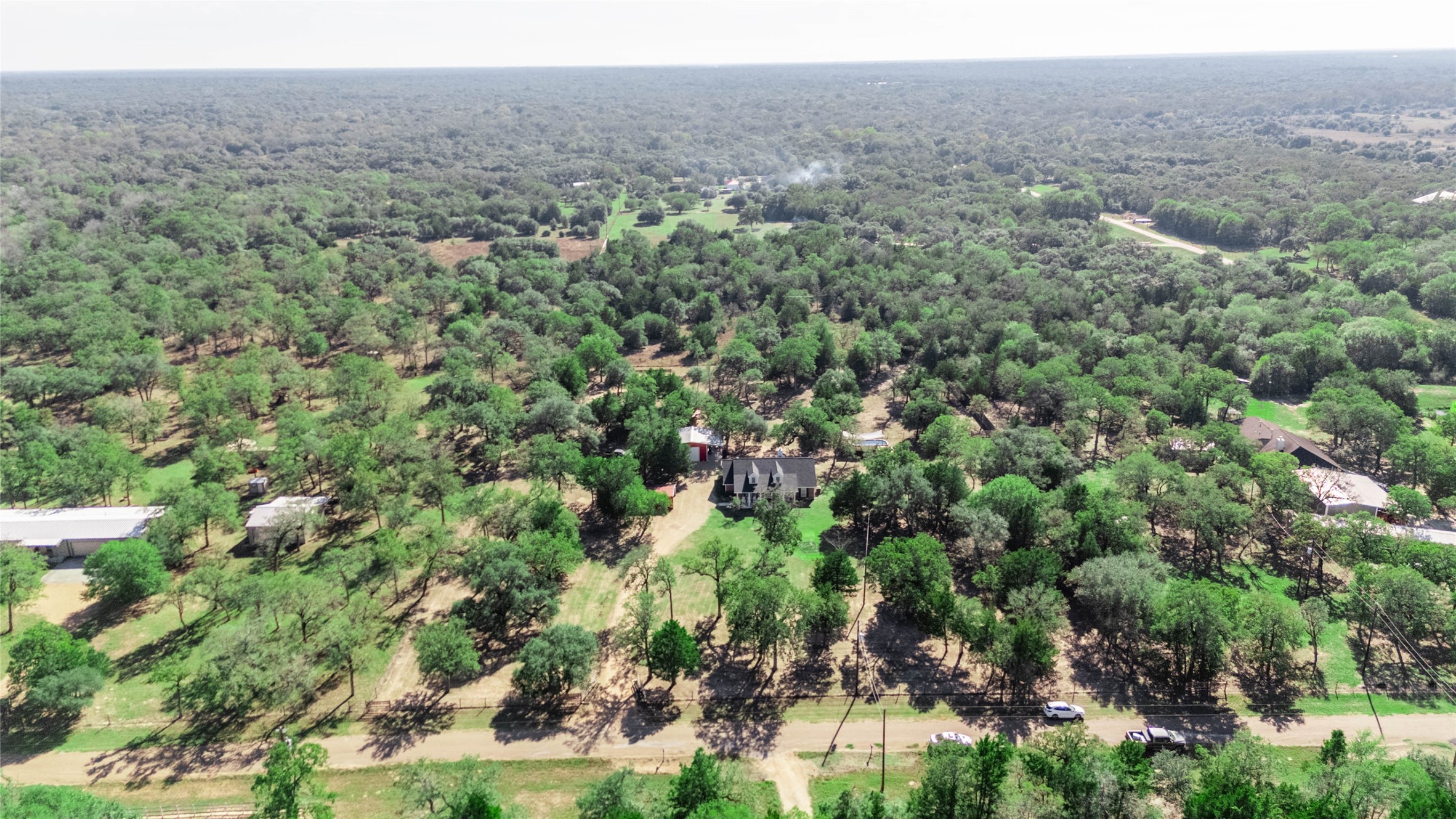 1779 County Road 151 Columbus, TX 78934 - Photo 43 of 47 a view of a forest with a street