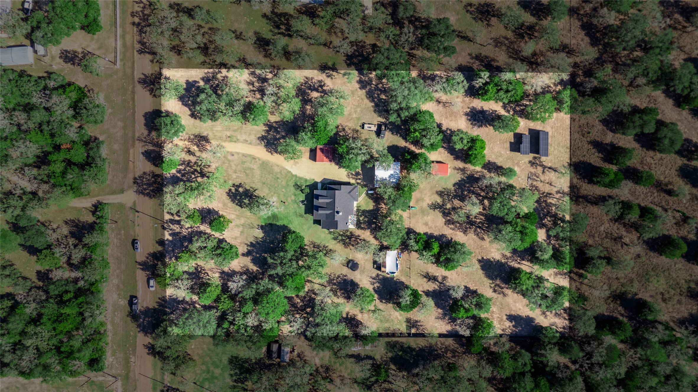 1779 County Road 151 Columbus, TX 78934 - Photo 44 of 47 an aerial view of residential house with outdoor space and trees all around
